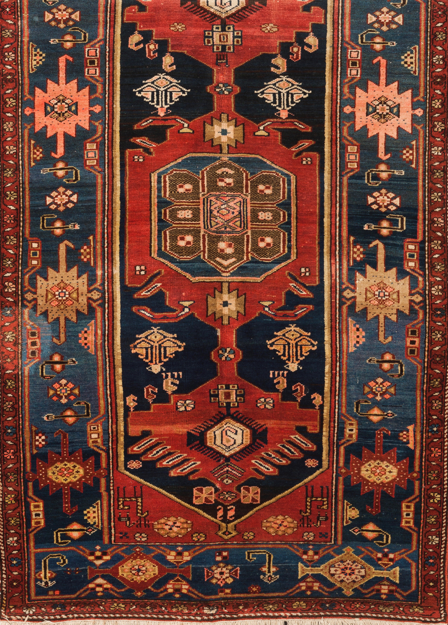 A Hamedan carpet, Iran Cotton and wool Of geometric and floral design in blue and red 225x130 cm