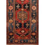 A Hamedan carpet, Iran Cotton and wool Of geometric and floral design in blue and red 225x130 cm