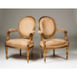 A pair of Louis XVI fauteuils Carved and gilt wood Beige velvet upholstered seats and backs