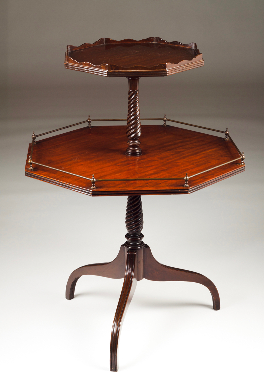 A Dumbwaiter Mahogany Central column on tripod foot One shelf with gallery England, 19th century