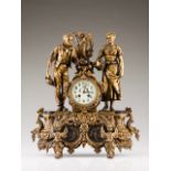 A late 19th, early 20th century French table clock Relief and gilt antimony representing peasants