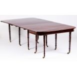 A Regency stretchable dining table Mahogany Turned legs and feet with castors Stretching system with