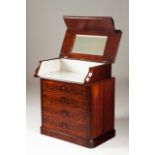 A small Victorian commode Mahogany With four drawers Top opens to reveal a mirror and marble
