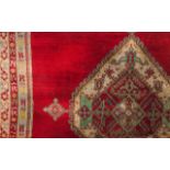 A carpet, Morocco Cotton and wool Floral and geometric decoration in red, blue and beige (fringes of