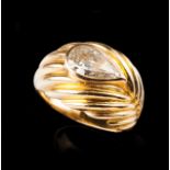 A diamond ring Gold with fluted decoration and set with one pear shaped diamond (ca. 1,30ct) with