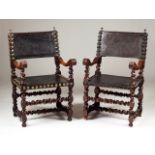 A set of two armchairs Walnut Engraved leather backs and seats with brass pins Decorated with