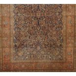 A Tabriz carpet, Iran Cotton and wool Geometric and floral decoration in beige, salmon and brown