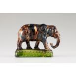 An "elephant" toothpick holder Faience Polychrome decoration with drained glazing Late 19th, early