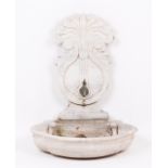 A wall fountain Marble With reservoir and sculpted upper part 19th century Height: 82 cm