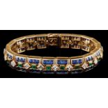 A gem-set bracelet, CARTIER Set in 18kt gold with 114 calibrated square buff-top sapphires, 19