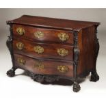 A D. João V commode Rosewood Three long drawers Scalloped and carved apron Ball and claw feet Brass