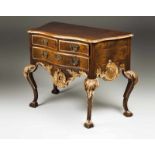 A D. João V/ D. José style commode Walnut Carved and gilt wood Scalloped apron Two short and one