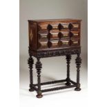 A cabinet Rosewood Turned and ripple decoration, with eight drawers simulating twelve Carved apron