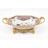 A deep dish Chinese export porcelain Polychrome Famille Rose decoration with floral motifs Gilt and