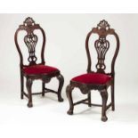 A set of two D. João V style chairs Rosewood Pierced and scalloped backs Red velvet upholstery