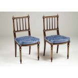 A pair of Empire style chairs Mahogany Decorated with gilt metal mounts and blue velvet upholstery