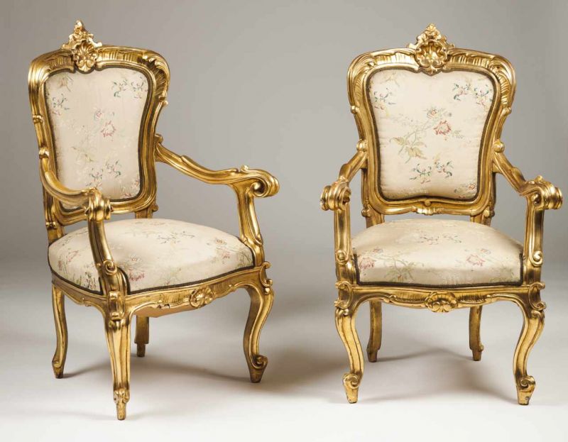 A pair of Louis XV style fauteuils Carved and gilt wood Silk upholstered seats and backs France,