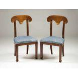 A pair of Directory style chairs Mahogany Scalloped, carved and gilt rails 15.00 % buyer's premium
