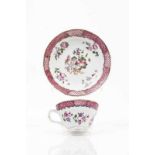 A cup and saucer Chinese export porcelain Polychrome Famille Rose decoration depicting flowers and