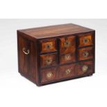 A cabinet Rosewood and other woods With six drawers simulating nine Brass mounts Portugal, 18th