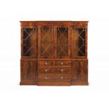 A George III cabinet Mahogany Upper body with four glazed doors and shelves at the interior Lower