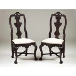 A pair of D. José style chairs Ebonized wood Scalloped and carved rails qirh floral and shell