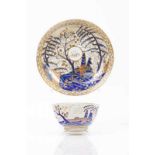 A cup and saucer Chinese export porcelain Rich polychrome decoration in shades of blue, salmon and