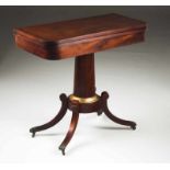 A card table Mahogany Central column on four legs with ball and claw brass feet with castors Green