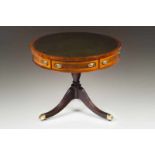 A centre table Mahogany and other woods veneered wood Leather lined top with gilt engraved frieze