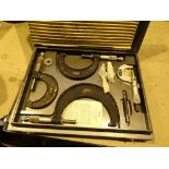 Boxed micrometers and electric drill
