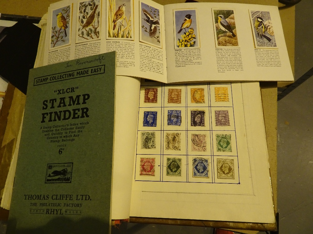 Album of worldwide postage stamps and an album of bird portrait teacards