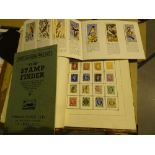 Album of worldwide postage stamps and an album of bird portrait teacards