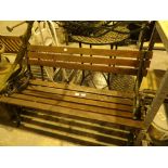 Wooden slat garden bench with cast iron ends