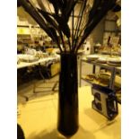 Floral decoration black vase with orchids and lillys