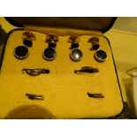 Boxed yellow metal stud set