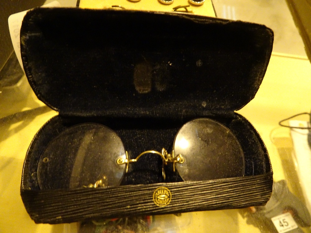 Pair of cased Pince Nez antique glasses