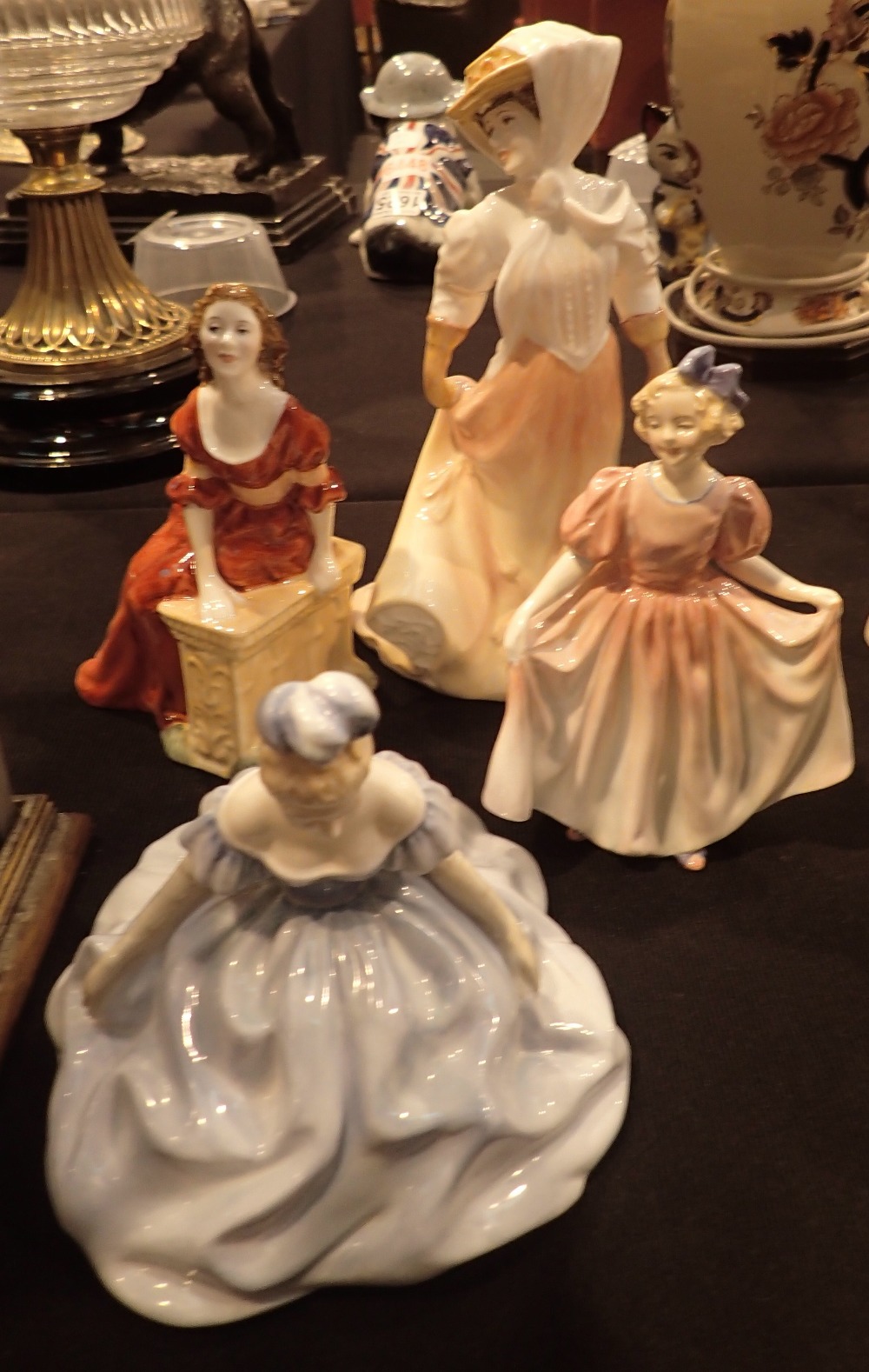 Four Royal Doulton figurines Debutante HN2210 Sweetling HN1935 The Open Road HN4161 and Judith