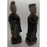 Pair of cast Oriental figurines heads probably reglued