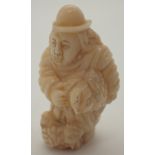 Chinese carved bone gentleman signed L: 3 cm