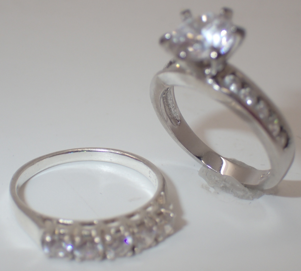 925 silver solitaire ring and a 925 silver half eternity ring sizes J and K
