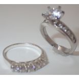 925 silver solitaire ring and a 925 silver half eternity ring sizes J and K