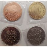 Four coins to include £5 coin and a Manchester £2.