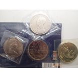 Four coins to include uncirculated £5 coin