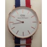 Yellow metal Daniel Wellington gents wristwatch with canvas strap and rose gold plated case