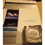 2004 Concorde Calender Concorde menu and a crystal paperweight