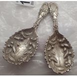 Pair of unmarked silver caddy spoons