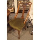 Four upholstered carved Edwardian dining chairs
