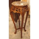 Chinese planter with marble top on a carved hardwood base