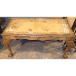 Walnut glass topped coffee table with carved edging and large ball and claw feet 89 x 44 x 48 cm