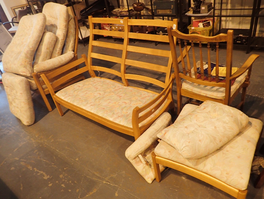 Three piece light wood Ercol suite armchair two seat settee and stool and a further chair